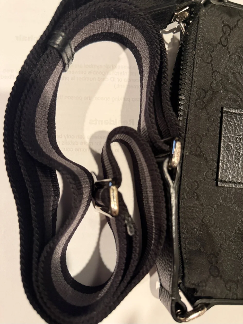 Authentic Gucci Black GG Monogram Messenger Bag with Striped Strap